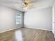 Bedroom with ceiling fan and window with blinds at 5144 Conroy Rd # 35, Orlando, FL 32811
