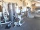 Modern gym featuring weight machines and other exercise equipment for residents at 5144 Conroy Rd # 35, Orlando, FL 32811