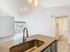 Modern condo kitchen with stainless steel appliances and light gray cabinets at 5144 Conroy Rd # 35, Orlando, FL 32811