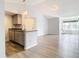 Modern condo kitchen with stainless steel appliances and light gray cabinets at 5144 Conroy Rd # 35, Orlando, FL 32811