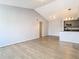 Bright living room with vaulted ceilings and wood-look floors at 5144 Conroy Rd # 35, Orlando, FL 32811