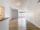 Bright living room with wood-look floors and large window at 5144 Conroy Rd # 35, Orlando, FL 32811