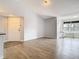 Open living area with wood-look floors and neutral walls at 5144 Conroy Rd # 35, Orlando, FL 32811