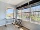 Sunlit office space with a corner desk and large windows at 5144 Conroy Rd # 35, Orlando, FL 32811