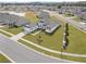 Expansive aerial view of a single-story home with lush greenery in a serene, residential neighborhood at 530 Sanctuary Blvd, Winter Haven, FL 33881