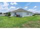 This backyard features a landscaped yard and view of the Sun Room at 530 Sanctuary Blvd, Winter Haven, FL 33881