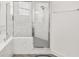 The bathroom features a glass enclosed shower with marble tile surround and fixtures at 530 Sanctuary Blvd, Winter Haven, FL 33881