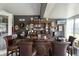 Custom bar with decorative accents featuring an extensive collection of glassware and spirits at 530 Sanctuary Blvd, Winter Haven, FL 33881