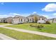 Charming home with a manicured lawn and stone accents at 530 Sanctuary Blvd, Winter Haven, FL 33881