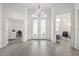 Bright foyer with beautiful floors, grand doors, and easy access to other rooms at 530 Sanctuary Blvd, Winter Haven, FL 33881
