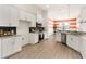 Modern kitchen featuring stainless steel appliances, granite countertops, and stylish backsplash at 530 Sanctuary Blvd, Winter Haven, FL 33881