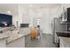 Modern kitchen features stainless steel appliances, granite countertops, and wood floors at 530 Sanctuary Blvd, Winter Haven, FL 33881
