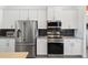 Well-equipped kitchen boasts stainless steel appliances, sleek cabinetry, and ample countertop space at 530 Sanctuary Blvd, Winter Haven, FL 33881