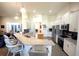 Bright and spacious kitchen with a granite island, stainless steel appliances, and ample cabinetry at 530 Sanctuary Blvd, Winter Haven, FL 33881