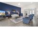 Spacious living room with wood flooring, a ceiling fan, and comfortable seating arrangement at 530 Sanctuary Blvd, Winter Haven, FL 33881