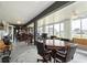 Bright sunroom featuring a game table, wet bar, and ample space for entertaining at 530 Sanctuary Blvd, Winter Haven, FL 33881