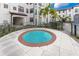 Relaxing hot tub area with surrounding landscaping at 5550 E Michigan St # 1128, Orlando, FL 32822