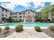 Inviting community swimming pool with lounge chairs at 5550 E Michigan St # 1128, Orlando, FL 32822