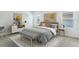 Bright bedroom with gray bedding, bench at foot of bed, and dresser at 5626 Paddock Fence Ln, Apopka, FL 32712