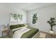 Bedroom with green bedding and a large window at 5626 Paddock Fence Ln, Apopka, FL 32712