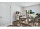 Dining area with table and chairs, adjacent to sliding glass doors at 5626 Paddock Fence Ln, Apopka, FL 32712