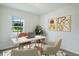 Home office with white desk and two beige chairs at 5626 Paddock Fence Ln, Apopka, FL 32712