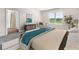 Bright bedroom with window, ensuite access, and modern furniture at 5632 Paddock Fence Ln, Apopka, FL 32712