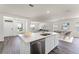 Open concept kitchen with island and stainless steel appliances at 5632 Paddock Fence Ln, Apopka, FL 32712