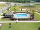 Community pool with lounge chairs and cabana at 5632 Paddock Fence Ln, Apopka, FL 32712