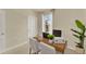 Home office with a desk, chairs, and large window at 5879 Galloping Dr, Apopka, FL 32712