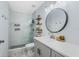 Modern bathroom with a walk-in shower and gray vanity at 625 Greencove Ter # 123, Altamonte Springs, FL 32714