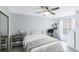 Bedroom with a queen bed, ceiling fan, and built-in dresser at 625 Greencove Ter # 123, Altamonte Springs, FL 32714