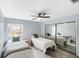 Two twin beds in a bright bedroom with mirrored closet doors at 625 Greencove Ter # 123, Altamonte Springs, FL 32714