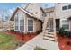 Townhouse exterior with stairs leading to the entrance and landscaping at 625 Greencove Ter # 123, Altamonte Springs, FL 32714