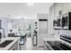 Modern kitchen with gray cabinets and stainless steel appliances at 625 Greencove Ter # 123, Altamonte Springs, FL 32714