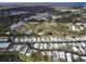 This aerial shot displays the property's prime location within a lively manufactured home community with green spaces at 662 Sinclair Cir, Tavares, FL 32778