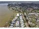 Beautiful aerial view of a lakeside neighborhood with mature trees and private boat access at 662 Sinclair Cir, Tavares, FL 32778