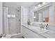 Updated bathroom featuring a vanity with a modern sink, a walk-in shower, and nice tile at 662 Sinclair Cir, Tavares, FL 32778