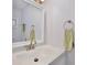 Clean bathroom with a white vanity, updated fixtures, and ample lighting at 662 Sinclair Cir, Tavares, FL 32778
