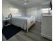 Comfortable bedroom with neutral tones, ample natural light, and a spacious closet at 662 Sinclair Cir, Tavares, FL 32778