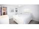 Bright bedroom features a bed, side table, and ample closet space at 662 Sinclair Cir, Tavares, FL 32778