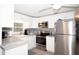 Modern kitchen featuring stainless steel appliances, stylish countertops and ample cabinet space at 662 Sinclair Cir, Tavares, FL 32778