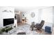Open concept living area with modern furnishings and a seamless flow to the dining area at 662 Sinclair Cir, Tavares, FL 32778