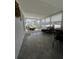 Enclosed patio featuring an area rug, seating, and a comfortable area for relaxation at 662 Sinclair Cir, Tavares, FL 32778
