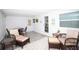 Inviting sunroom featuring cozy furniture, decor, and plenty of natural light at 662 Sinclair Cir, Tavares, FL 32778