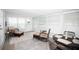 Bright sunroom with tile floor and comfortable seating area perfect for relaxing at 662 Sinclair Cir, Tavares, FL 32778