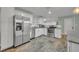 Modern kitchen with stainless steel appliances and granite countertops at 7104 Wrenwood Way, Winter Park, FL 32792