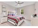 Cozy bedroom featuring a comfortable bed, modern decor, and a ceiling fan for added comfort at 729 Grand Hilltop Dr, Apopka, FL 32703