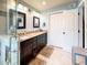 Bathroom features a double sink vanity, tile floors, and walk-in shower at 848 Bucksaw Pl, Longwood, FL 32750