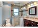 Bathroom featuring a tiled shower, granite counter, single sink and vanity at 848 Bucksaw Pl, Longwood, FL 32750